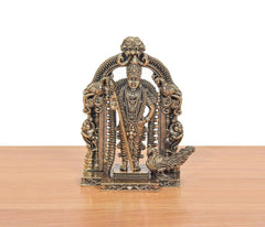 Brass Murugan deity figurine standing, ornate beaded garlands and arched prabhavali