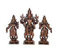 Copper Vishnu, Shridevi and Bhudevi statues with raised hands, front view