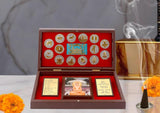Metal Jain pooja gift box (8 inch): open lid with gold Jain emblems and photo cards