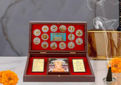 Metal Jain pooja gift box (8 inch): open lid with gold Jain emblems and photo cards