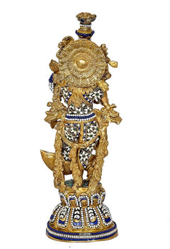 Brass Radha Krishna idol back view, gold ornate crown and blue accents on base