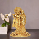 Brass Radha Krishna idol statue, Radha and Krishna embracing on ornate pedestal