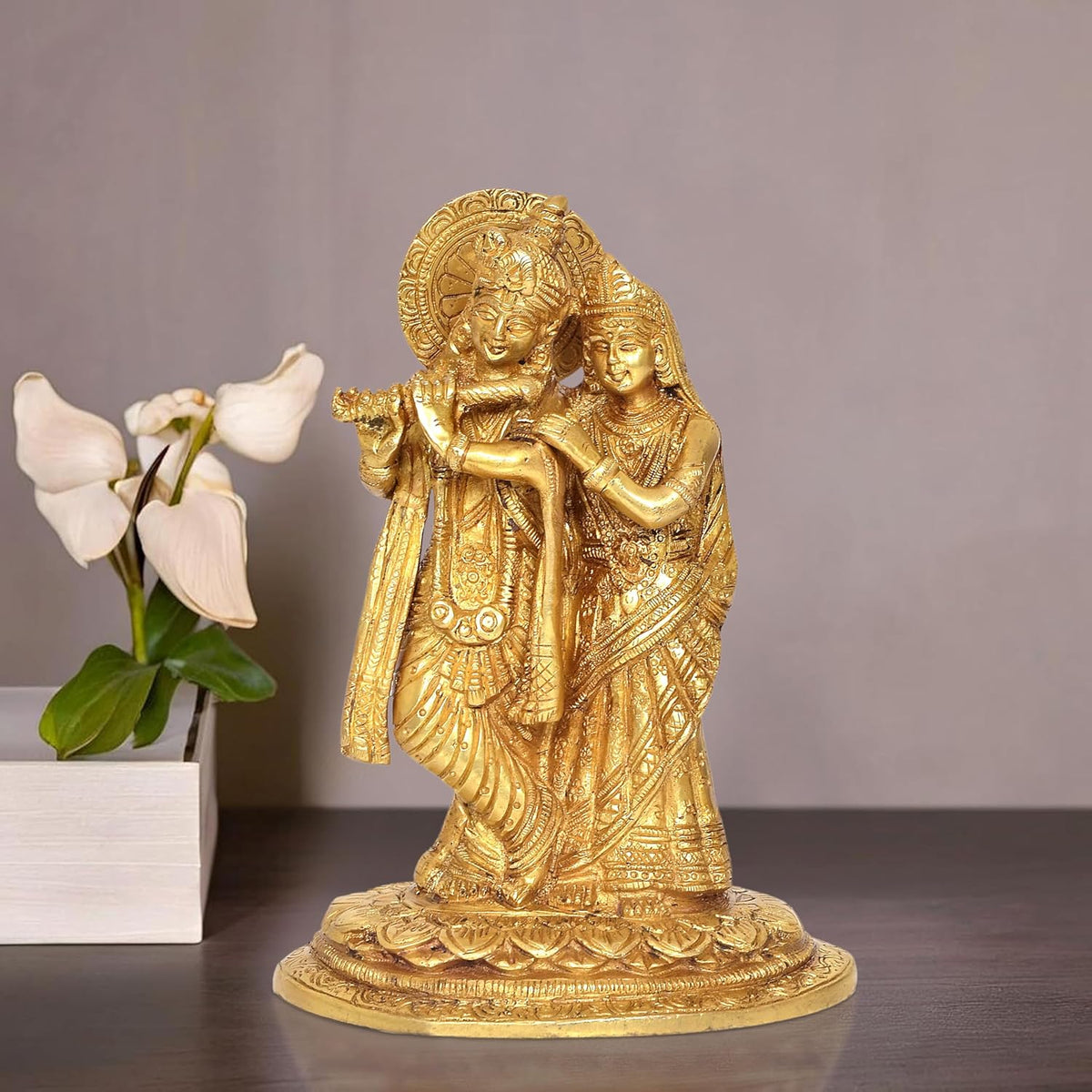 Brass Radha Krishna idol statue, Radha and Krishna embracing on ornate pedestal