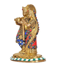 Radha-Krishna brass idol with red and blue gem accents, side view on round base