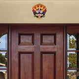 Nazar Battu wall hanging mounted high on door, small demon face protective emblem