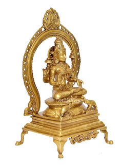 Brass Lakshmi statue angled view, prabhavali arch and decorative footed base