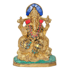Brass Ganesha idol statue facing forward, blue crown, red and green accents on robe