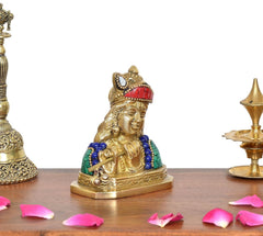 Brass Krishna flute idol front view, red crown, green robe panels, blue necklace