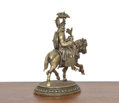 Brass horse rider idol, rear three-quarter view showing ornate back and mane, 5 inch