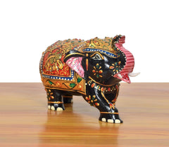 Black wooden elephant figurine with multicolor decorative coat, curled tail and painted feet