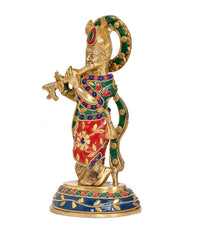 Brass Krishna idol statue in red and green with jeweled garlands, side view on base