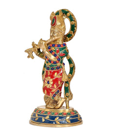 Brass Krishna idol statue in red and green with jeweled garlands, side view on base