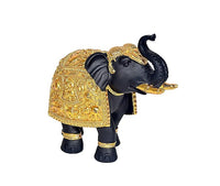 Side view of dark resin elephant showpiece with gold ornate armor-style covering