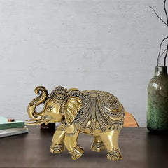 Gold-tone brass elephant figurine with ornate headgear and raised trunk, 4 inch decor