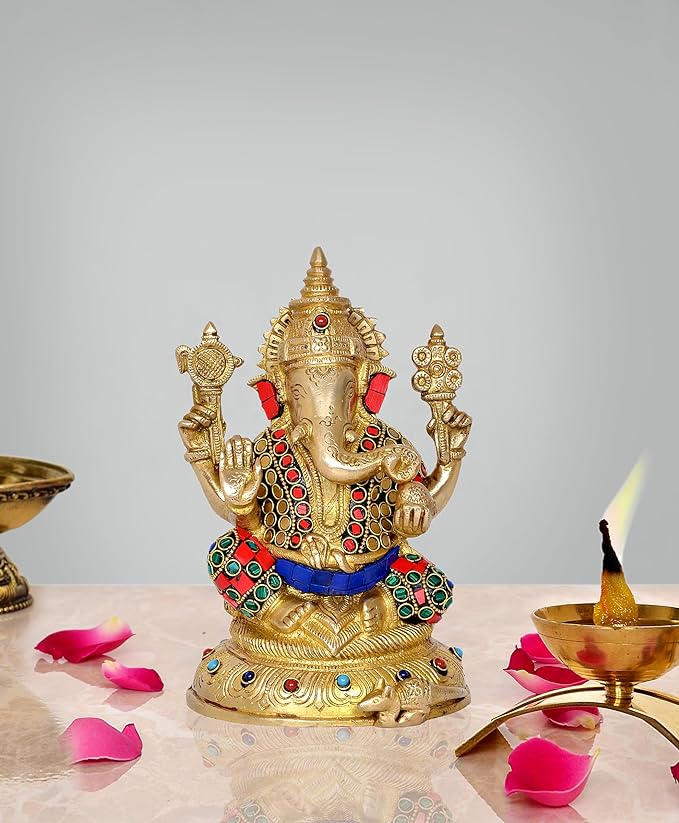 Brass Lord Ganesha idol with red trunk, jeweled crown and blue sash, seated stance.
