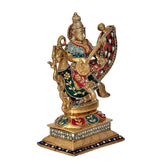 Brass deity statue of Saraswati on swan, raised hand and musical instrument motif