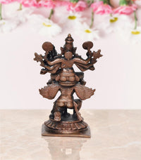 Copper Vishnu decorative showpiece, front view of multi-armed figure with halo and crown