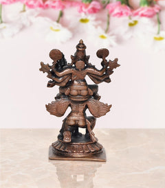Copper Vishnu decorative showpiece, front view of multi-armed figure with halo and crown