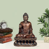 Resin Buddha idol sculpture, seated with hands in lap, dark blue-gold base