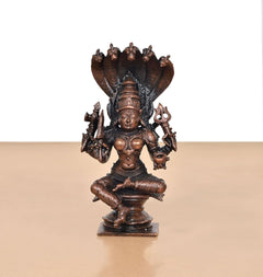 Seated copper goddess idol with raised arms, detailed cobra-hood canopy, 5 inch