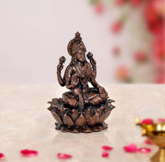 Copper Laxmi Maa statue 3/4 view, seated on lotus petals, 3.5 in