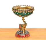 Brass elephant urli idol with green bowl and ornate handle, painted red dress