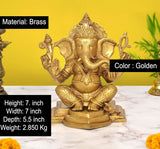 Brass seated Lord Ganesha figurine, golden finish; size shown: 7.5 in
