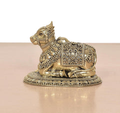 Brass seated Nandi statue with detailed saddle ornament and beaded border