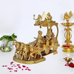 Brass Arujana Rath statue on round base with chariot, horses, and attendant figures.