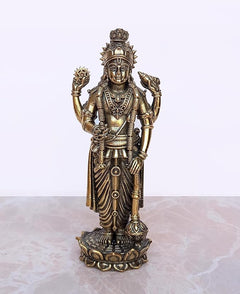 Brass Lord Vishnu standing idol with crown, four-armed pose, on ornate base