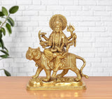 Brass Durga Maa statue seated on lion, golden finish, front view