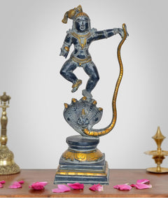 Krishna on Kaliya Naag brass statue, blue-black finish with gold accents, full figure