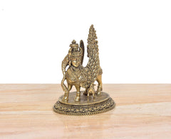 Kamadhenu cow with calf and tall wing crest idol, three-quarter view