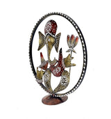 Iron Ganesha idol showpiece with circular border, dark frame, red cap and gold accents