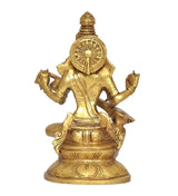Back view of brass Saraswati statue, circular emblem on head and ornate detailing