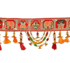 Close-up toran trim with elephant motifs, red border, layered bead garlands, tassels