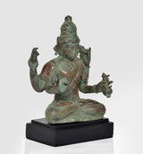 Vintage Lord Vishnu bronze statue, seated with four arms, detailed crown, on black base