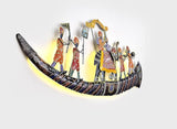 Iron wall decor with left-side standing figures and ornate center rider on curved base