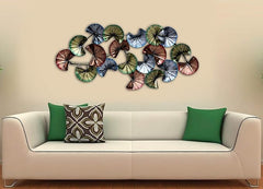 Wrought iron wall art with overlapping circular petal shapes, multicolor finish.