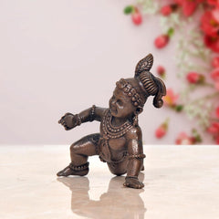 Bal Gopal Krishna laddu idol, side view crouch, dark copper finish
