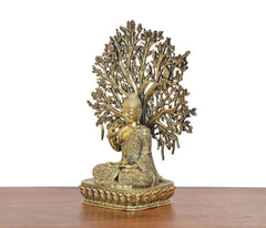 Brass-gold Buddha tree showpiece, side view of seated figure with leaf branches