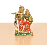 Brass Radha-Krishna figurine on green base, red and green attire with gold accents
