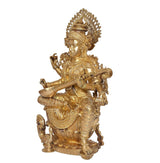 Brass Saraswati idol side view, veena in arms, seated on ornate pedestal
