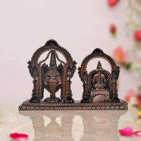 Rear angle of Venkateshwara and Padmavathi idol set with decorative temple frames