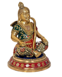 Close angle Ram Lalla brass idol sitting pose with jeweled belt and red-green-blue accents