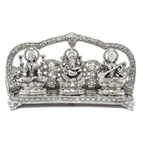 Silver metal Ganesha, Lakshmi & Saraswati sculpture on arched ornate base