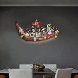Wall-mounted iron boat decor with multicolored figures and red umbrella; LED glow