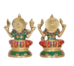 Brass Lakshmi-Ganesh idols, side view: two deities with halo details and tricolor attire