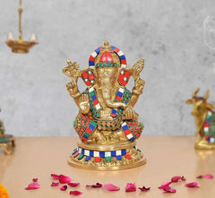 Brass Ganesha idol with multicolored ornaments, raised hands, front view (8 in)