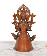 Back view of brass seated Tara Devi statue with star-like halo details